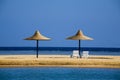 Parasols on a beach in the morning Royalty Free Stock Photo