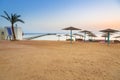 Parasols on the beach of Red Sea in Hurghada at sunrise Royalty Free Stock Photo