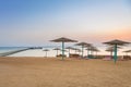 Parasols on the beach of Red Sea in Hurghada at sunrise Royalty Free Stock Photo