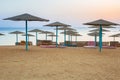 Parasols on the beach of Red Sea in Hurghada at sunrise Royalty Free Stock Photo