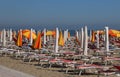 parasols and deck chairs in the sun-drenched beach in summer