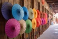 parasols displayed in a row at a traditional shop