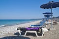 Parasols and sunbeds on the beach Royalty Free Stock Photo