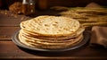 A paratha bread, resembling a flaky, golden-brown layered disc, glistening with a buttery sheen