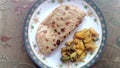 Paratha with cooked potatoes and broccoli