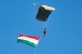 Paratrooper flying in the sky. Extreme sport and Xgames. Jumping with Hungarian flag. Royalty Free Stock Photo