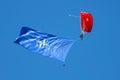 Paratrooper flying in the sky. Extreme sport and Xgames. Jumping with NATO flag. Royalty Free Stock Photo