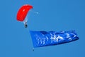 Paratrooper flying in the sky. Extreme sport and Xgames. Jumping with NATO flag. Royalty Free Stock Photo