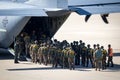 Paratroopers entering a US Air Force C-130 Hercules transport plane on Eindhoven airbase. The Netherlands - September 20, 2019 Royalty Free Stock Photo