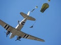 Paratroopers jumping from a C-47 aircraft