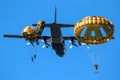 Paratroopers jumping out of a Lockheed Martin C-130 Hercules military aircraft. The Netherlands - September 21, 2019