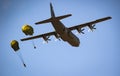 Paratroopers jumping out of a US Air Force Lockheed Martin C-130 Hercules transport plane. The Netherlands - September 21, 2019