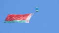 Paratroopers in the sky with the Belarusian flag on the May 9 Victory Day in Mogilev, Belarus Royalty Free Stock Photo