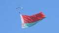 Paratroopers in the sky with the Belarusian flag on the May 9 Victory Day in Mogilev, Belarus Royalty Free Stock Photo
