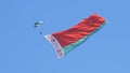 Paratroopers in the sky with the Belarusian flag on the May 9 Victory Day in Mogilev, Belarus Royalty Free Stock Photo