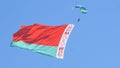 Paratroopers in the sky with the Belarusian flag on the May 9 Victory Day in Mogilev, Belarus Royalty Free Stock Photo