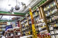 bottles of cachaca on a shelf, inside a shop in the historic city of Paraty