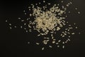 Parboiled long-grain rice on a black background. organic coarse rice Royalty Free Stock Photo