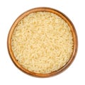 Parboiled long grain rice, converted rice in wooden bowl Royalty Free Stock Photo