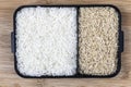 Parboiled white rice and integral rice on the wooden table Royalty Free Stock Photo