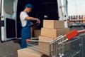 Parcel boxes in cargo cart, delivery service Royalty Free Stock Photo