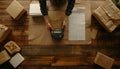 Parcel packing. Post office worker with scanner reading barcode at wooden table, top view Royalty Free Stock Photo