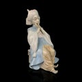 Parcel statuette of a young girl. porcelain antique girl figurine