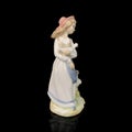 Parcel statuette of a young girl. porcelain antique girl figurine Royalty Free Stock Photo