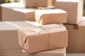 Parcel with tag and blurred stacked boxes