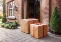 Parcel on the threshold of the entrance to the house near the door, delivery of goods to the house