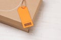 Parcel tied with string with address orange label attached Royalty Free Stock Photo