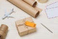 Parcel tied with string with address orange label attached Royalty Free Stock Photo