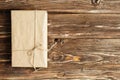 parcel wrapped with brown kraft paper and tied with twine Royalty Free Stock Photo