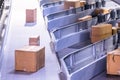 Parcels on conveyors with blurred industrial background Royalty Free Stock Photo