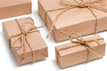 Parcels wrapped, gift boxes with brown kraft paper and tied with twine and bows. Isolated on white background, top view, close-up Royalty Free Stock Photo