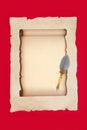 Parchment Paper Scroll with Decorative Brass Feather Quill Pen Royalty Free Stock Photo