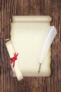 Parchment Paper Scroll with White Feather Quill Pen Royalty Free Stock Photo