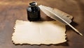 Parchment, quill and inkwell on a wooden table seen from above.