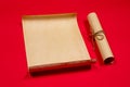 Parchment scroll for the to-do list on a red background. Glider, day planning, place for text and for entries. Copyspace. Old Royalty Free Stock Photo