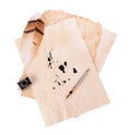 Parchment with stains of ink, feather pen and inkwell on white background, top view Royalty Free Stock Photo