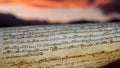 Parchment with a sunset background.