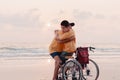 Family of teenager boy on Wheelchair on vacation at the beach Royalty Free Stock Photo