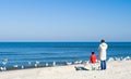 Parent and child on beach Royalty Free Stock Photo