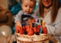 Parent and child celebrating first birthday Royalty Free Stock Photo