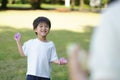 Parents and children playing with water balloons Royalty Free Stock Photo