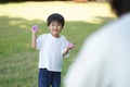 Parents and children playing with water balloons Royalty Free Stock Photo