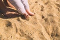 Mother and little baby feet on beach sand. Royalty Free Stock Photo