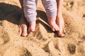 Mother and little baby feet on beach sand. Royalty Free Stock Photo