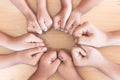 Parent and children fist hands in circle