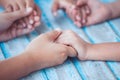 Parent and children holding hands and praying together Royalty Free Stock Photo